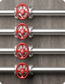 Copper pipes with valves on a wall