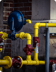 Yellow gas pipes with valves and gauge